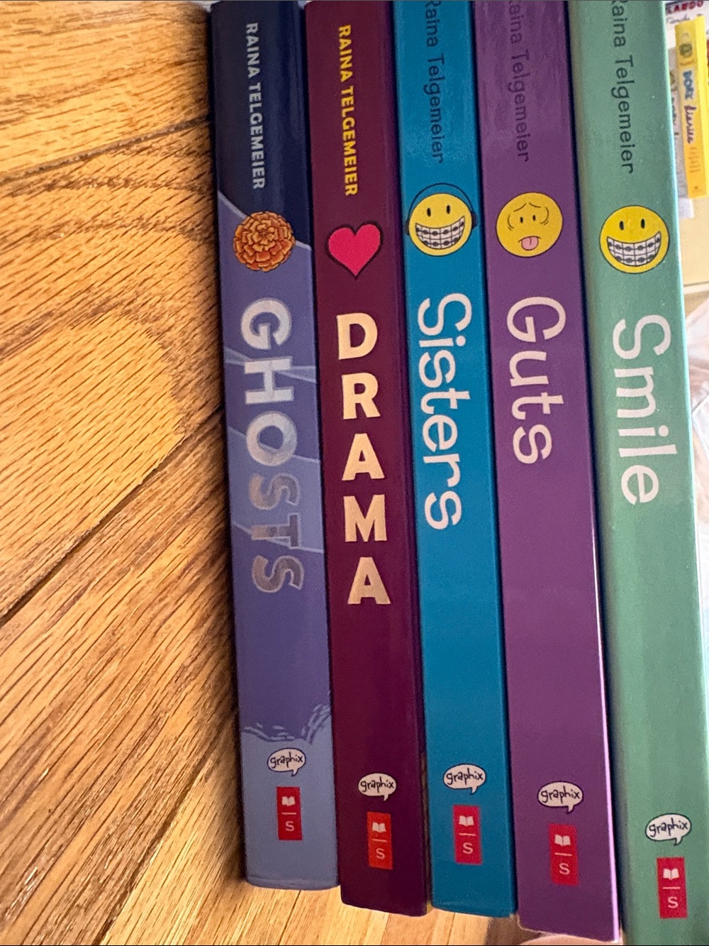 Scholastic "Ghosts" Graphic Novel - Purple Cover with Red and Blue Accents